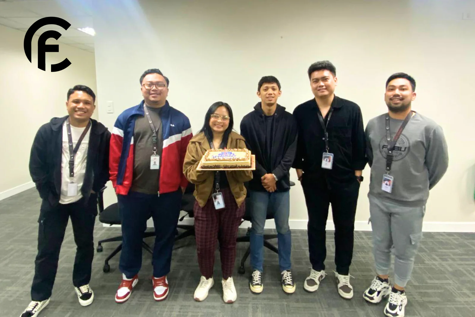 CF team members celebrating a birthday at the office (photo 1 of 6)